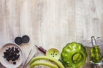 Hookah on a wooden background. Tobacco fruit. Selective focus.  