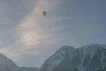 mountain scenery, mountains with hot air balloon flying in the sky