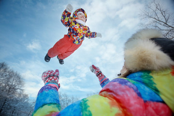 Mom throws baby winter walk