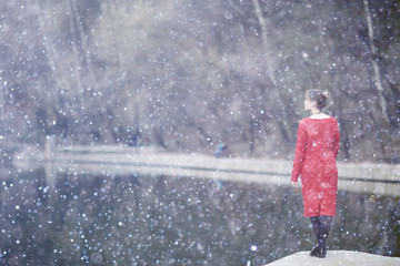 young woman dreaming in the city outside of the winter