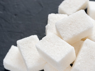background of white sugar cubes with copy space