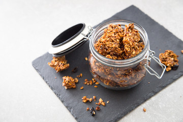Healthy breakfast. Fresh granola, muesli in a glass jar. 