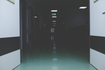 Open door to the dark hallway of hosptal