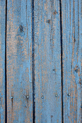 Fototapeta na wymiar Old lath fence with peeled paint