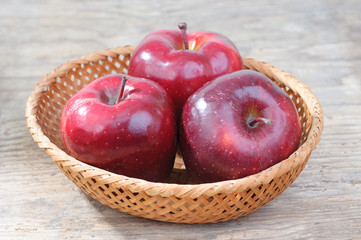fresh red apples in basket