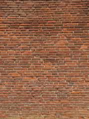 rectangular red bricks of an old wall