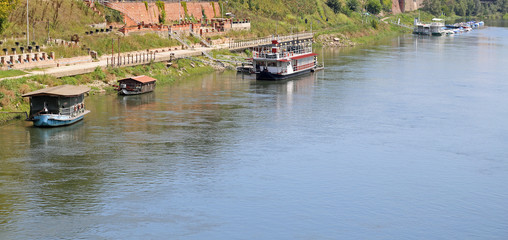 boats and the ticino river from the wooden bridge