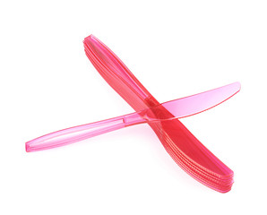 Pile of disposable knives isolated