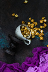 Homemade Golden Caramel Popcorn in a cup