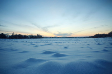 winter landscape with a horizon, field and sky