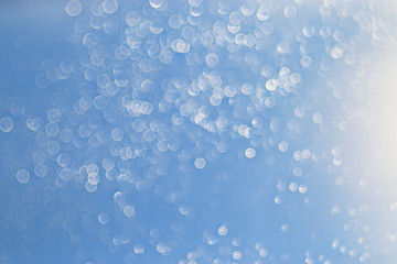 light blue background bokeh drops glass, blurred