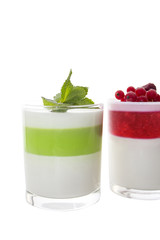 Two Panna cotta with mint, red currant