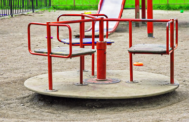 baby red swing carousel in Dore