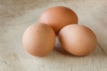 Chicken eggs on an old, wooden background