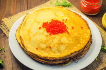 red caviar on pancakes. Russian cuisine
