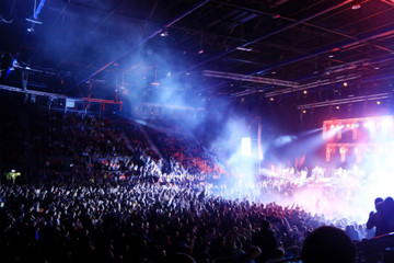 Fototapeta na wymiar crowd at a rock concert spotlight background blur