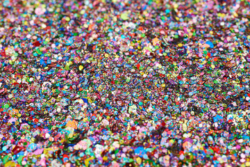 Fototapeta na wymiar Surface coated with colorful sequins