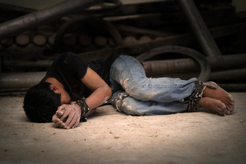 hopeless man hands tied together with rope
