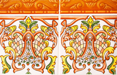 Detail of the traditional tiles from facade of old house. Spain. Valencia. Floral ornament. Majolica,