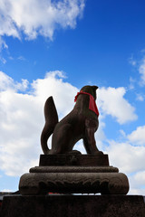 Dog statue in Japanese temple on blue sky background