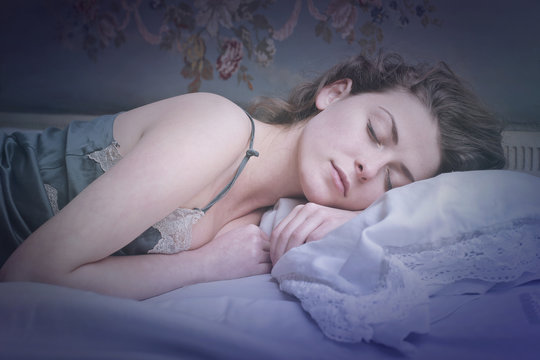Girl sleeping tight in bed 