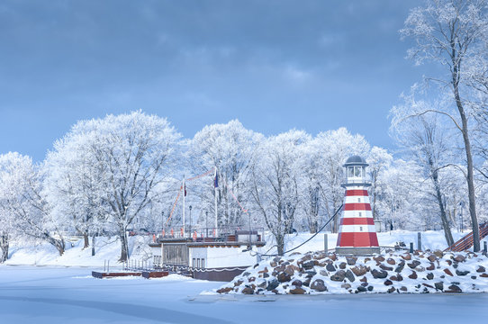 Navigation lighthouse on the winter coast