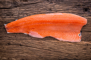 Salmon Fish..Raw salmon fillet wooden table. Studio shot.