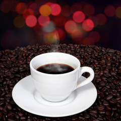 Coffee and smoke with blurry background.