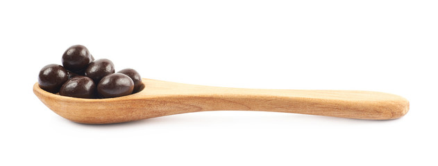 Wooden spoon full of candies