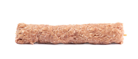 Raw kebab meat on a stick