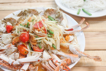 Spicy papaya salad with blue crab sea food.
