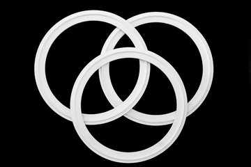 Rubber white silicone sealing spare parts for industryon black background.