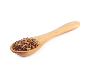 Wooden spoon of brown rice