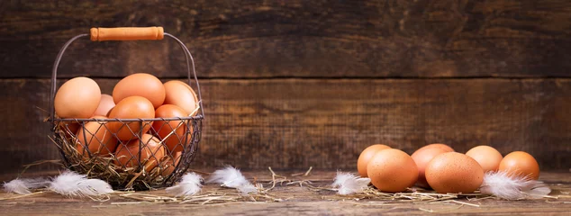 Foto auf Alu-Dibond frische Eier in einem Korb © Nitr