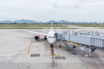 Aircraft at the gate in Airport terminal for boarding passengers.