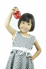 young girl show  sweet or bell pepper isolated, concept in campaign to children eating vegetable © khwanchai