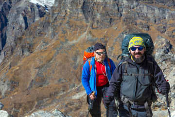 Portrait of Hikers in Mountain Landscape sporty Clothing and Gear