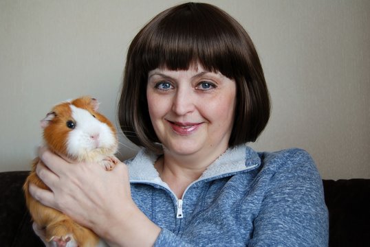 Woman Holding A Guinea Pig