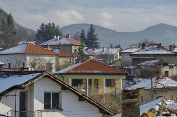 Residential district of bulgarian houses in winter village Pasarel, Bulgaria  