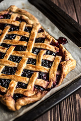 Homemade berry pie on a wooden background