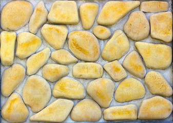 wall of gold and black shale, colorful wild natural stone. very beautiful