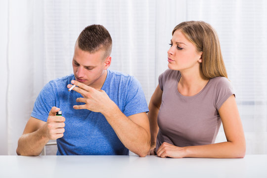 Wife is very angry because her husband doesn't want to stop smoking.
