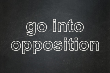 Fototapeta premium Politics concept: Go into Opposition on chalkboard background
