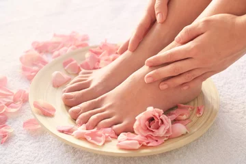 Fotobehang Female feet at spa pedicure procedure © Africa Studio