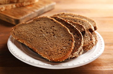 Sliced bread on wooden table closeup