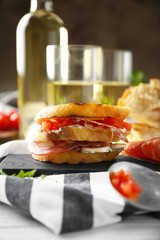 Delicious sandwich on wooden board