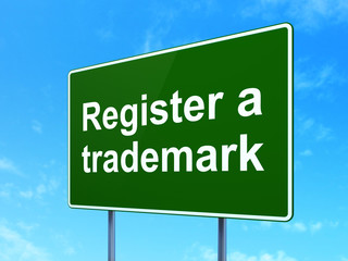 Law concept: Register A Trademark on road sign background
