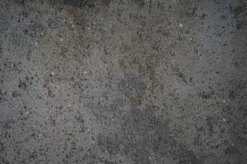 rough grey grungy concrete background, focus in the middle of frame