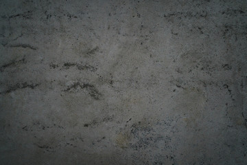rough grey grungy concrete background, focus in the middle of frame