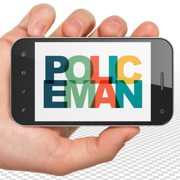 Law concept: Hand Holding Smartphone with Policeman on  display